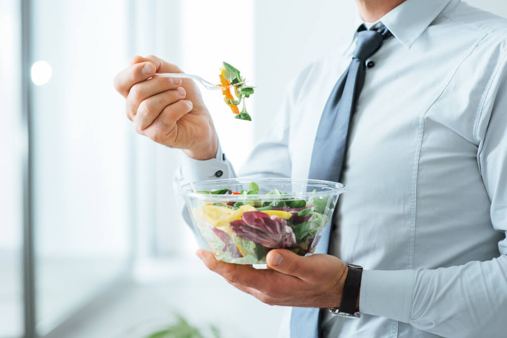 man eating salad